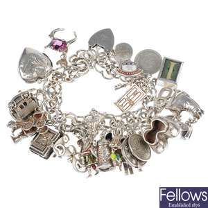 A silver and white metal charm bracelet.