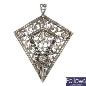 Three silver and white metal items of jewellery,