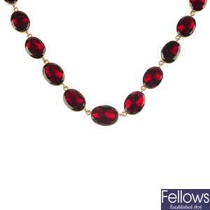 A mid 19th century gold garnet necklace, together with similarly designed ear pendants.