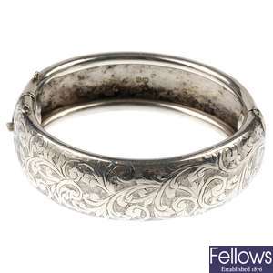 A selection of silver, white metal and gold plated bangles.