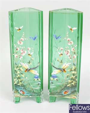 A good pair of enamelled emerald green glass vases