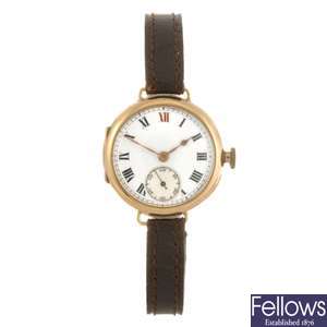 A 9ct gold manual wind gentleman's trench style wrist watch.
