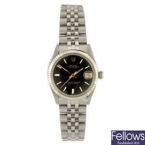 A stainless steel automatic mid-size Rolex Oyster Perpetual Date bracelet watch.