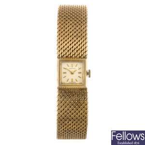 A 9ct gold manual wind lady's Longines bracelet watch.
