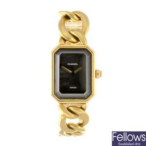 (108106473) An 18k gold quartz lady's Chanel bracelet watch.