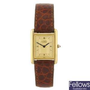 A gold plated quartz Must De Cartier wrist watch.