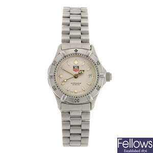 A stainless steel quartz lady's Tag Heuer 2000 Series bracelet watch.