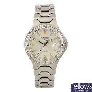 A stainless steel quartz gentleman's Longines bracelet watch with two other watches.