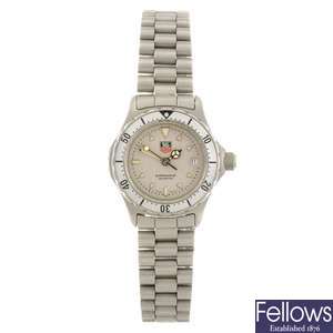 A stainless steel quartz lady's Tag Heuer 2000 Series bracelet watch.