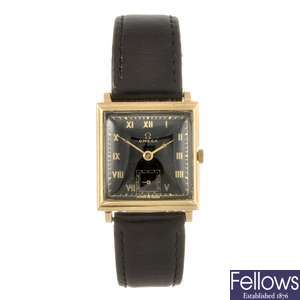 A 14k gold manual wind gentleman's Omega wrist watch.
