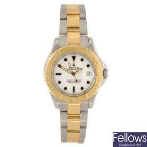 A bi-metal automatic mid-size Rolex Oyster Perpetual Yachtmaster bracelet watch.