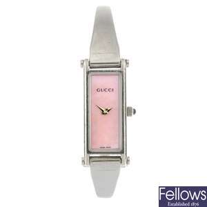 A stainless steel quartz lady's Gucci 1500L bangle watch.