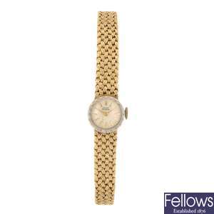 A 14k gold manual wind lady's Girard Perregaux bracelet watch.