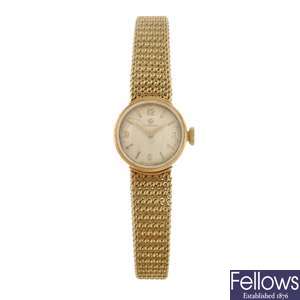 A 14k gold manual wind lady's Omega bracelet watch.