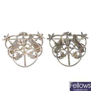 OLA M. GORIE - two silver brooches and two similar brooches.