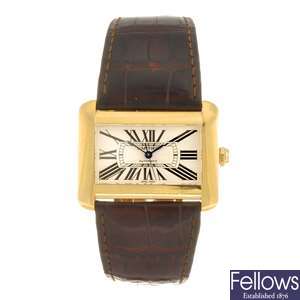 (134177147) An 18k gold automatic Cartier Divan wrist watch.