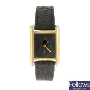 A gold plated silver manual wind Must de Cartier wrist watch.