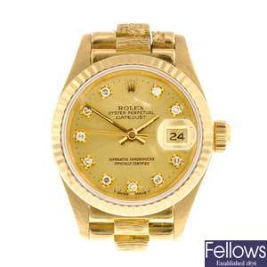 An 18k gold automatic lady's Rolex Datejust bracelet watch.