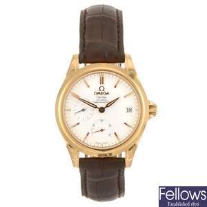 An 18k rose gold automatic Omega De Ville wrist watch.