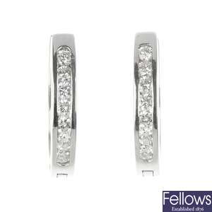 A pair of 18ct gold diamond ear hoops.