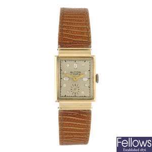 A 14k gold manual wind Alton wrist watch with a Benrus bracelet watch.