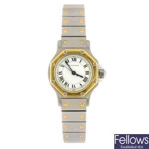 (205153541) A bi-metal automatic Cartier Santos bracelet watch.