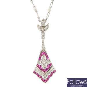A diamond, ruby and seed pearl pendant.