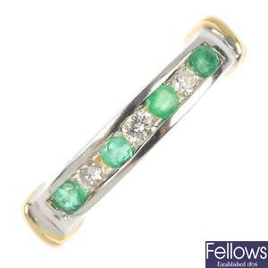 An 18ct gold emerald and diamond seven-stone ring.