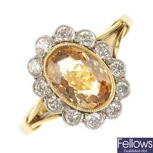 An 18ct gold topaz and diamond cluster ring.