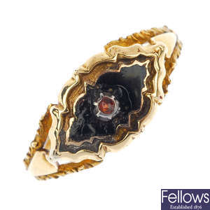 A mid 19th century 18ct gold red gem and enamel mourning ring.