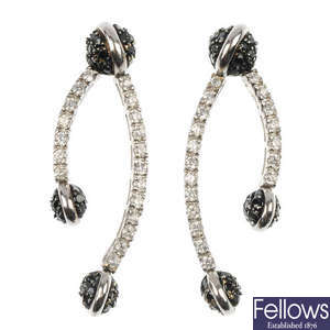 A pair of cubic zirconia ear pendants.