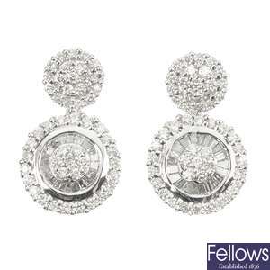 A pair of 18ct gold diamond cluster ear pendants.
