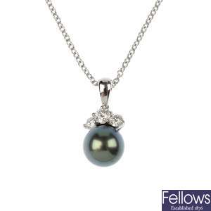 MIKIMOTO - an 18ct gold cultured pearl and diamond pendant.