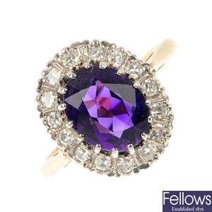 A mid 20th century 18ct gold and platinum amethyst and diamond cluster ring.