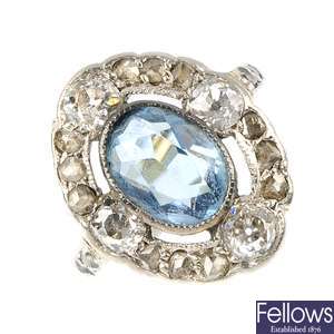 An early 20th century 15ct gold aquamarine and diamond cluster ring.