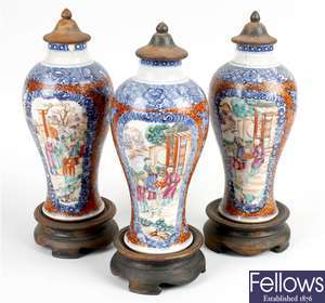 A garniture of three 19th century Chinese Canton famille rose porcelain vases