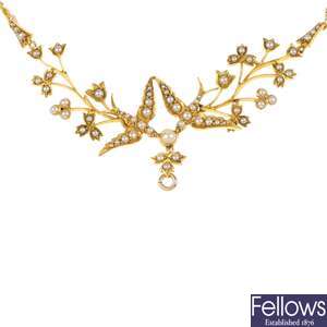 An early 20th century 15ct gold split pearl swallow necklace.