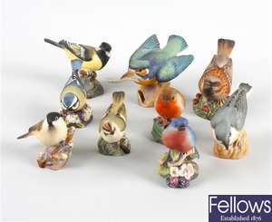 Nine Royal Worcester bone china bird ornaments
