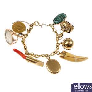 A late 19th century 18ct gold bracelet, suspending eight items.