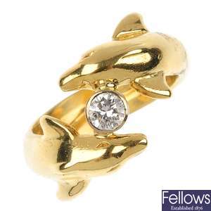 An 18ct gold diamond dolphin ring.