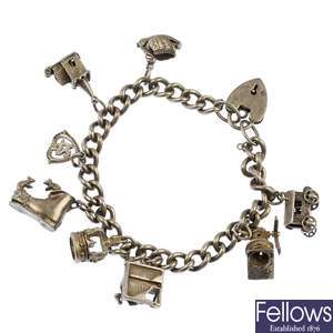 Four silver and white metal charm bracelets.