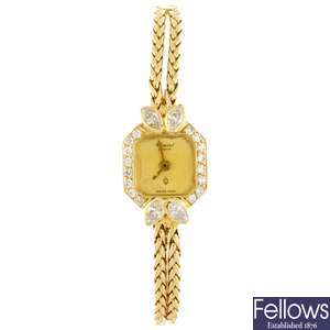 An 18k gold quartz lady's Chopard bracelet watch.