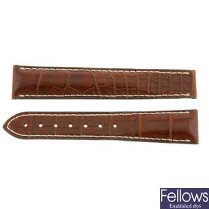 An Omega watch strap and deployant buckle.