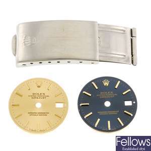 A pair of lady's Rolex Datejust watch dials with a Rolex watch clasp.