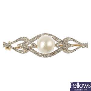 An early 20th century gold natural pearl and diamond brooch.