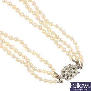 A pearl three-row necklace with 9ct gold diamond set clasp, a  cameo and mourning brooch.