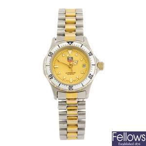 (951000760) A bi-colour quartz lady's Tag Heuer 2000 Series bracelet watch.
