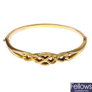 A late 19th century 9ct gold hinged bangle. 