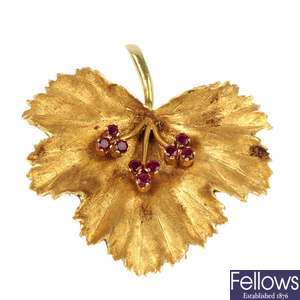 A 1960s 18ct gold ruby foliate brooch.