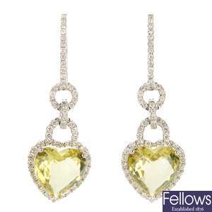 A pair of diamond and topaz ear pendants. 
